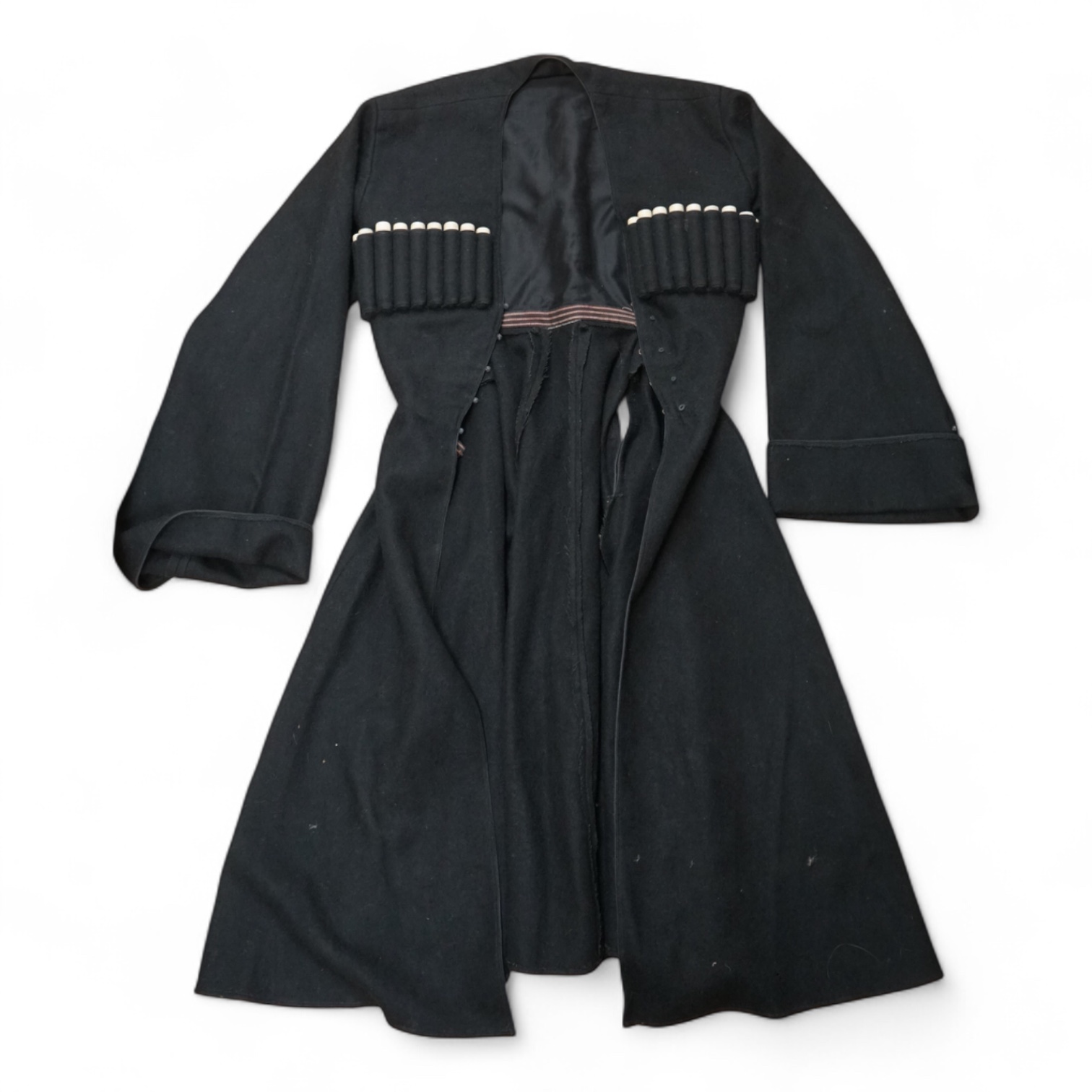 A theatrical gents black wool coat, with unusual pocket detail. 120cm long